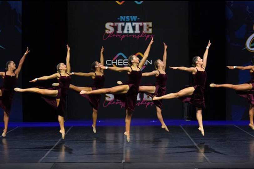 Graceful ballet dancers in sync with dark colour theme